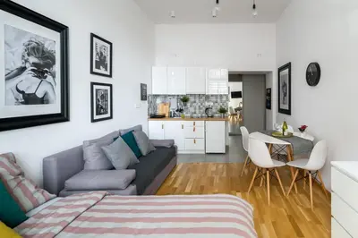 a living room with a couch and a table at Discover Krakow Apartments - 5 Borowickiej St - Studio next to Opera and Unity Centre in Kraków