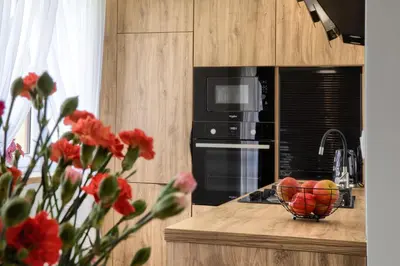 a kitchen with a bowl of fruit on a counter at Apart-Wita in Wadowice