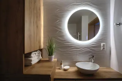 a bathroom with a sink and a mirror at Apart-Wita in Wadowice