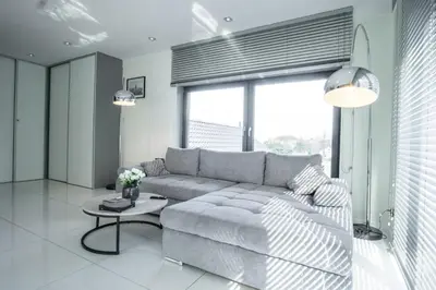a living room with a couch and a table at Willa Pod Zamczyskiem in Podzamcze