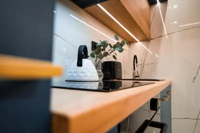 a kitchen with a counter with a stove top at Boutique 62 by Housine in Zator