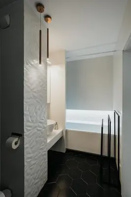 a bathroom with a sink and a bath tub at Arcade Old Town with Free Parking in Kraków