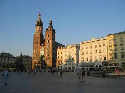 a group of people walking around a plaza in a city at Selene - Pantheon Apartments in Kraków