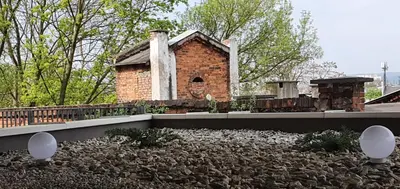 a small brick building on the roof of a house at Green Hill in Kraków