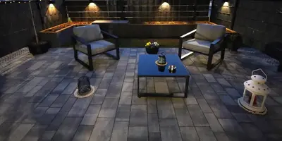 a patio with two chairs and a coffee table at Apartament LUX in Zator