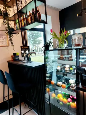 a bar with a display case in a restaurant at VANTA Business Center in Skawina