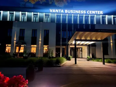 a building with a sign that reads vanta business center at VANTA Business Center in Skawina