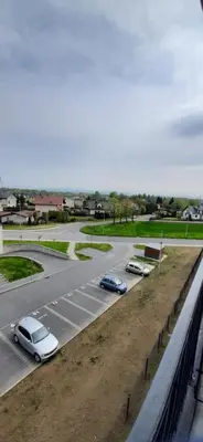 a group of cars parked on a road at Apartament 59 JUSTI in Zator