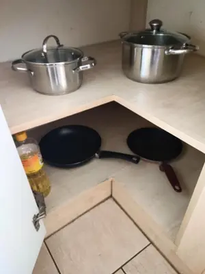 a kitchen with two pots and pans on a shelf at *** Cozy and bright apartment (over 50m2) *** in Kraków