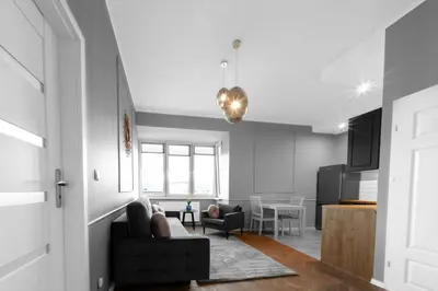 a living room with a couch and a table at Aleja Krasińskiego 5 by Homeprime in Kraków