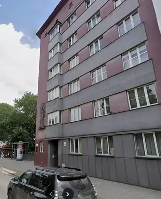 a car parked in front of a building at Aleja Krasińskiego 5 by Homeprime in Kraków