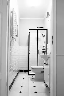 a white bathroom with a toilet and a sink at Aleja Krasińskiego 5 by Homeprime in Kraków