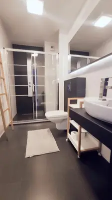 a bathroom with a sink and a toilet and a shower at Łokietka 8B by Homeprime in Kraków