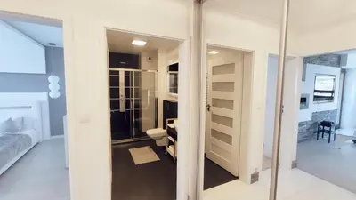 a room with a toilet and a glass door at Łokietka 8B by Homeprime in Kraków