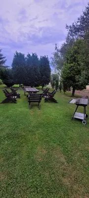 a group of picnic tables in a park at Noclegi u Eli Zator Energylandia in Zator