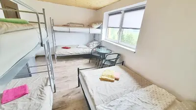 a dorm room with two bunk beds and a window at Noclegi u Eli Zator Energylandia in Zator