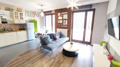 a living room with a couch and a table at Wrocławska 80 by Homeprime in Kraków