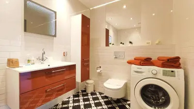 a bathroom with a washing machine and a sink at Wrocławska 80 by Homeprime in Kraków