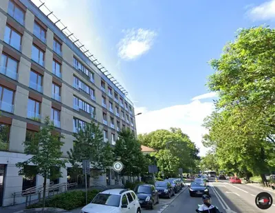 a street with cars parked next to a building at Wrocławska 80 by Homeprime in Kraków