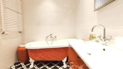 a bathroom with a tub and a sink at Wrocławska 80 by Homeprime in Kraków