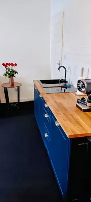 a kitchen with a sink and a wooden counter top at Old Town Gertrudy Apartment - Topolove Rooms & Apartments in Kraków