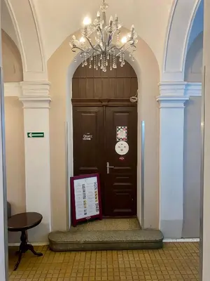 a large black door with a plaque in front of it at Old Town Gertrudy Apartment - Topolove Rooms & Apartments in Kraków