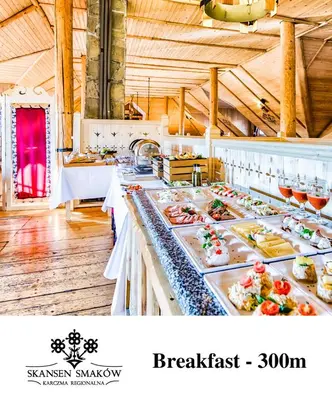 a buffet line with many different types of food at Skansen Forest in Liszki