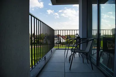 a desk with a painting and a pen and a basket of toys at Apartament The Palm 35 by Housine in Zator
