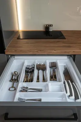 a drawer filled with utensils in a refrigerator at Bianco Apartamenty Laskowa - Zator in Zator
