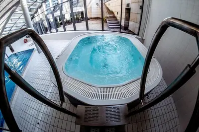 an overhead view of a swimming pool in a building at Premium Apartment for Old Town & Jewish Quarter plus Pool in Kraków