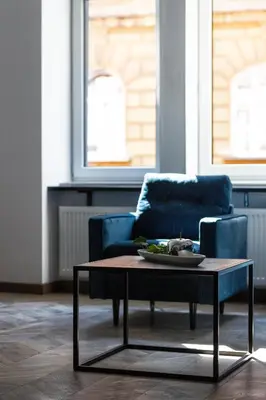 a living room with a coffee table and a couch at Aparts Jablonowskich in Kraków