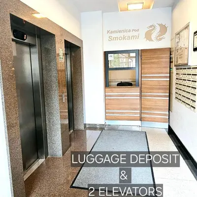 a lobby with two elevators in a building at Pawia Apartments Modern 2 in Kraków