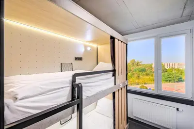 a bunk bed in a room with a window at Easy One Premium Art in Kraków