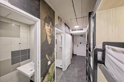 a corridor of a hospital room with a sink and a bathroom at Easy One Premium Art in Kraków