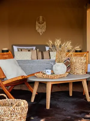 a living room with a couch and a coffee table at Zatoria Luxury Glamping ZATOR in Zator