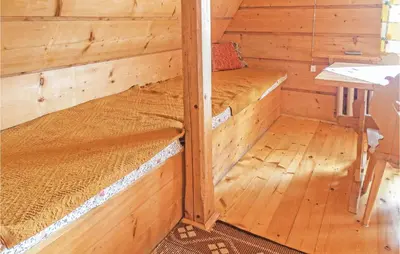 a wooden cabin with two bunk beds in it at Gorgeous Home In Mucharz With Sauna in Mucharz