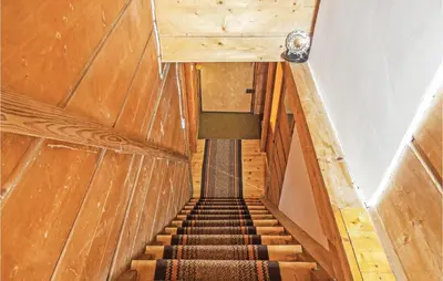 a view of a staircase in a wooden building at Gorgeous Home In Mucharz With Sauna in Mucharz