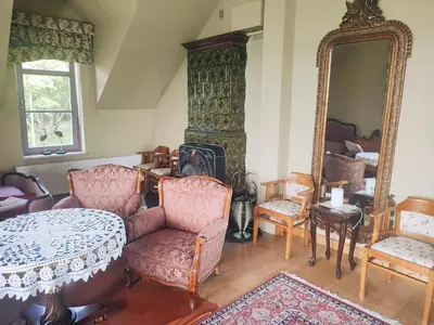 a bedroom with a bed in a attic with a window at Hortensjowe Wzgórze in Myślenice