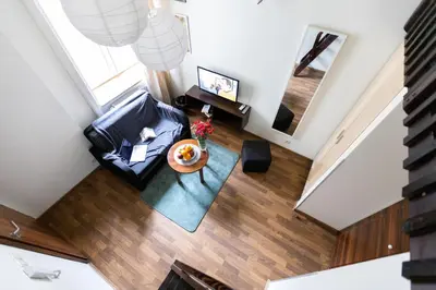 an overhead view of a living room with a couch and a table at Salve station in Kraków