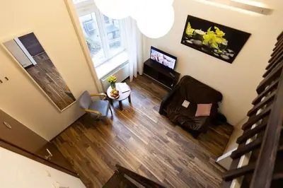 an overhead view of a living room with a couch and a television at Salve station in Kraków