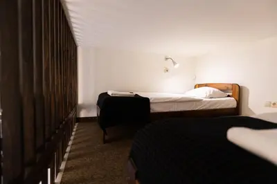 a hotel room with two beds in a room at Salve station in Kraków