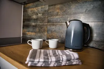 a coffee maker and two coffee cups on a counter at LOFT 24 by Housine in Zator