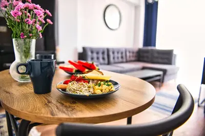a table with a plate of food on top of it at LOFT 24 by Housine in Zator