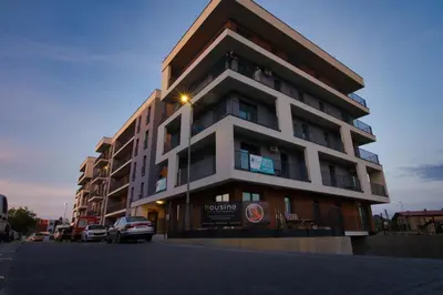 a building with a car parked in front of it at LOFT 24 by Housine in Zator