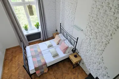 an overhead view of a bedroom with a bed at Urban Nest Apartments Dietla 69 in Kraków