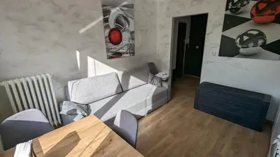 a living room with a couch and a table at Kalwaryjska Spot Apartment in a Good Location in Kraków