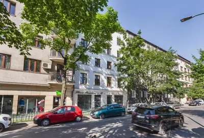 a street with cars parked in front of buildings at Blossom - Old Town Residence - by Upstairs in Kraków