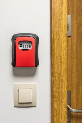 a red and black toaster on a wall next to a door at ENERGYLANDIA Zator Apartament Grześ in Zator