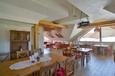 a dining room with tables and chairs in a restaurant at Villa & Gospoda Krakowska in Kobiernice