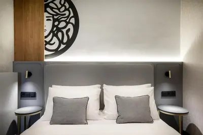 a bedroom with a bed with two pillows at Art Boutique in Kraków